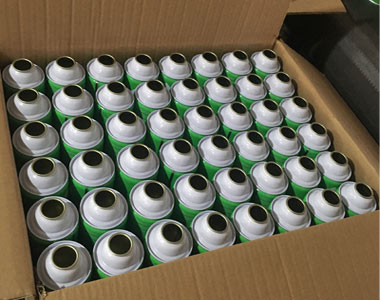 empty aerosol can in carton